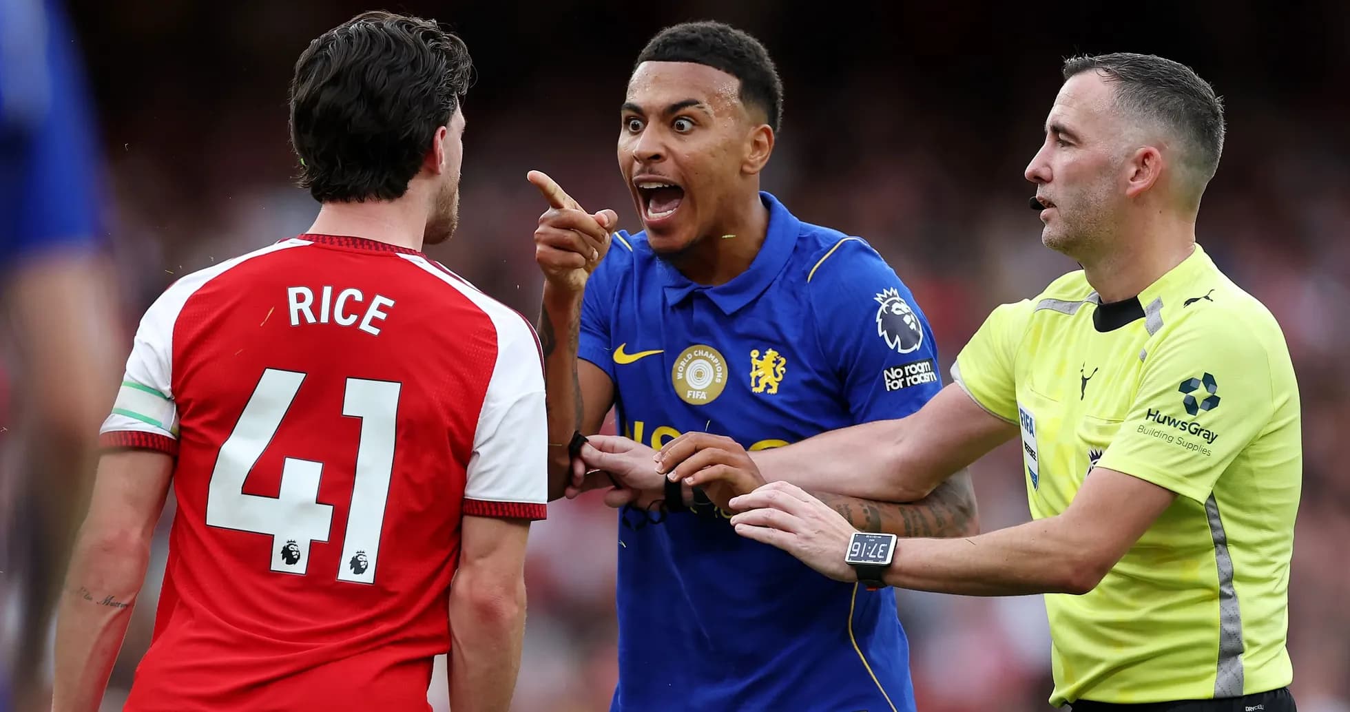 Players arguing during match, referee intervening