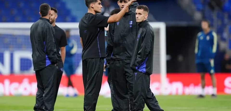 Players discussing during pre-match warm-up session