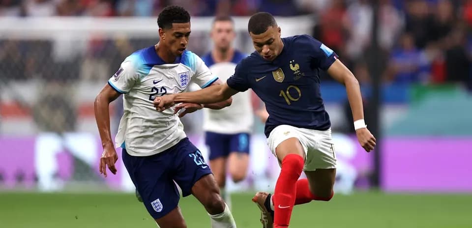 Mbappe and player competing for the ball
