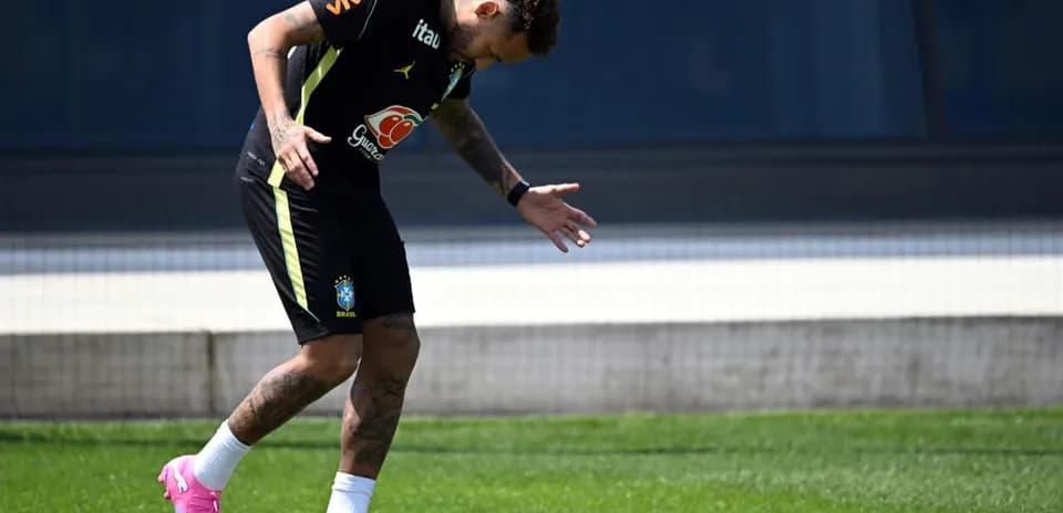 Neymar training on the pitch in Brazil kit