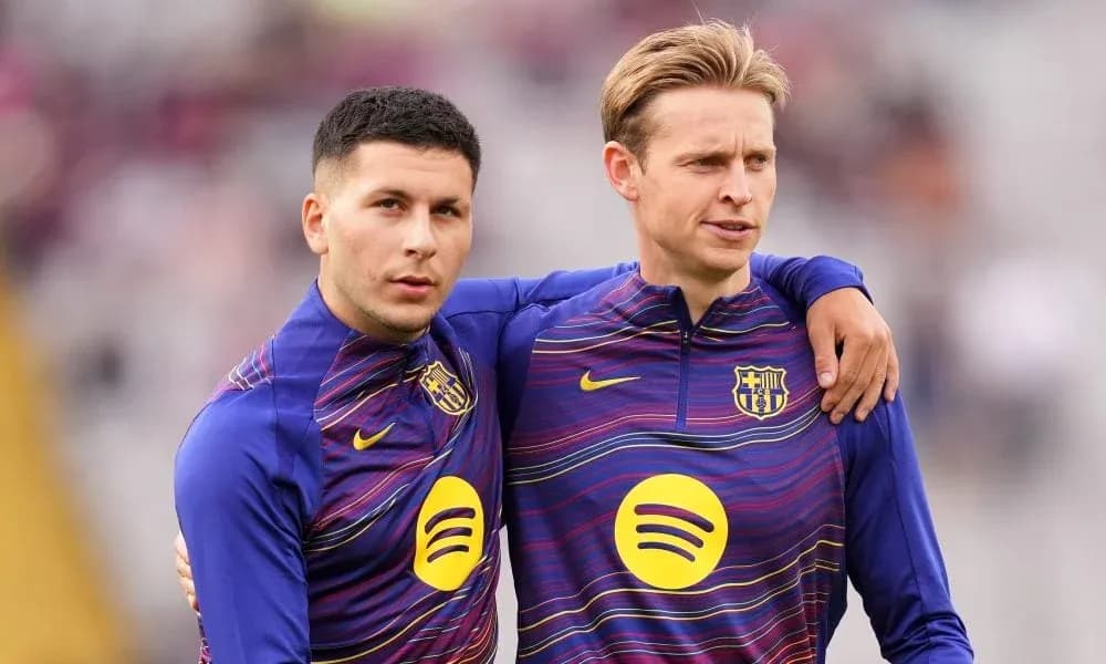 Two players in FC Barcelona training jerseys posing together