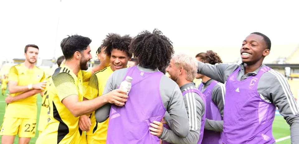 Players celebrating together after a match