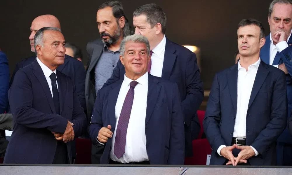 Group of officials in suits at a sporting event