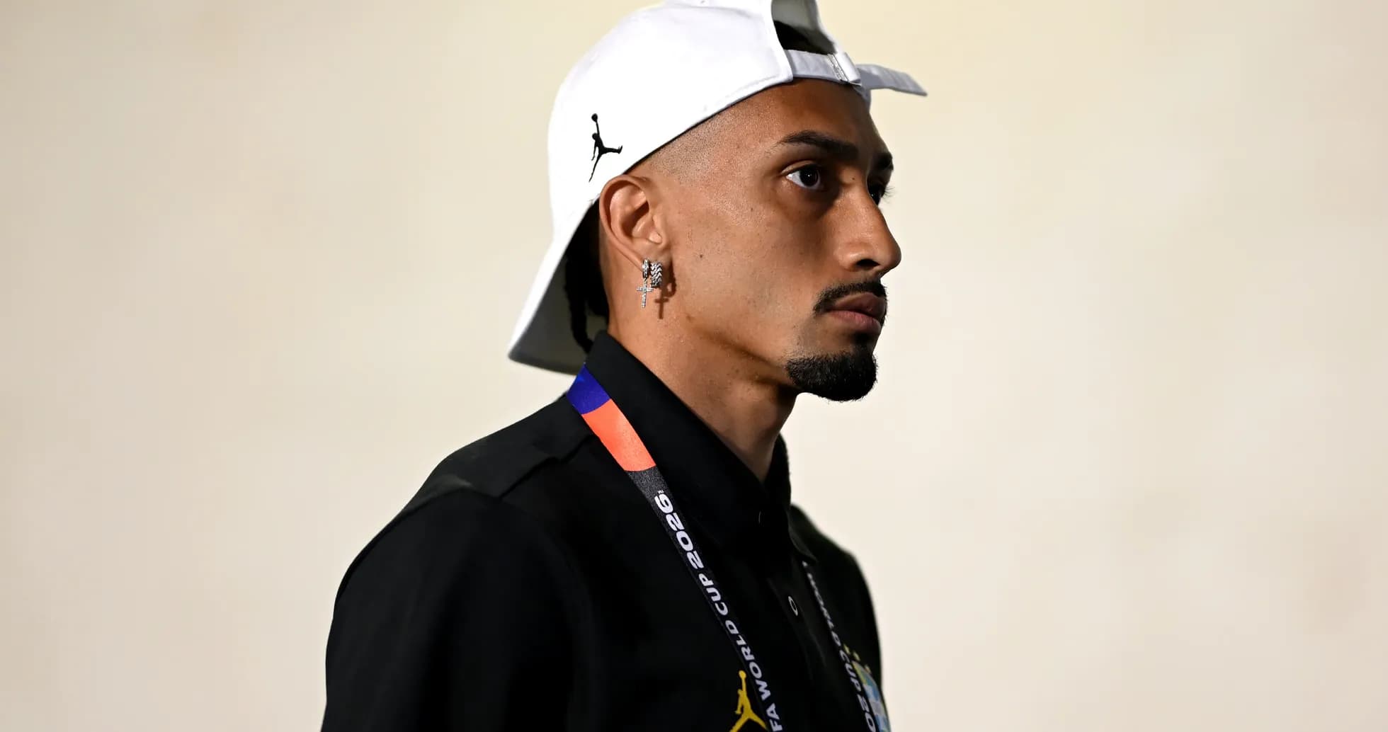 Person wearing a cap and FIFA World Cup credential