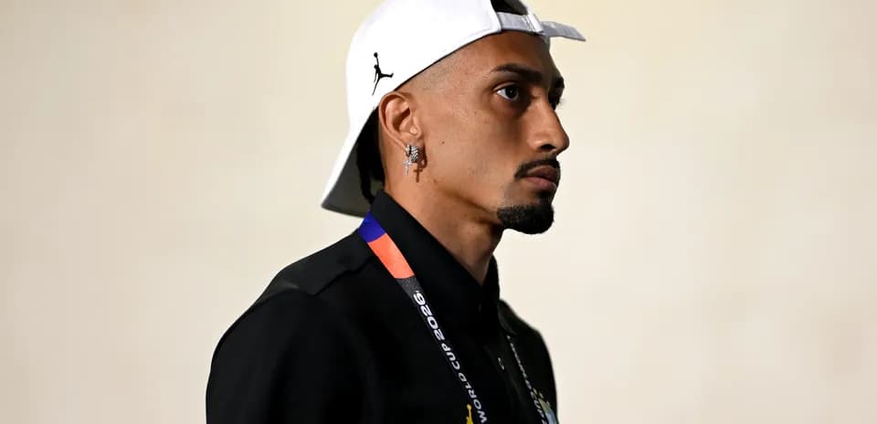 Person wearing a cap and FIFA World Cup credential