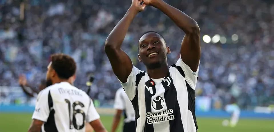 Player celebrating with fans after match victory