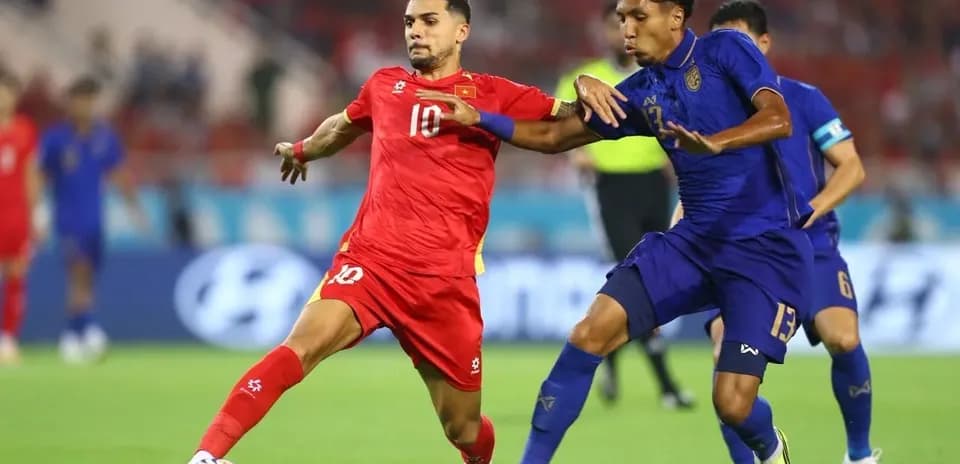 Two players competing for the ball during match