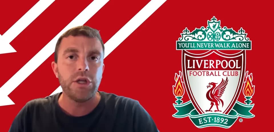 Person speaking with Liverpool FC logo in background