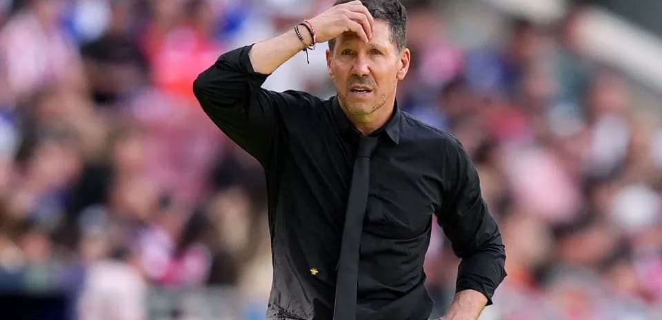 Coach looking concerned during a match