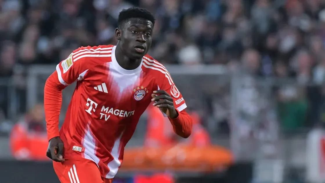 Player running on the field in Bayern Munich kit
