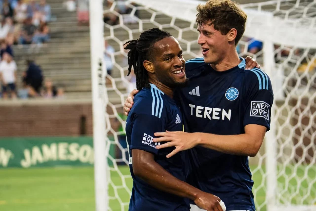 Players celebrating a goal during match