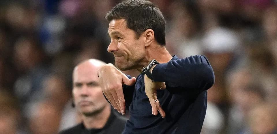 Coach gesturing during a match on the sidelines
