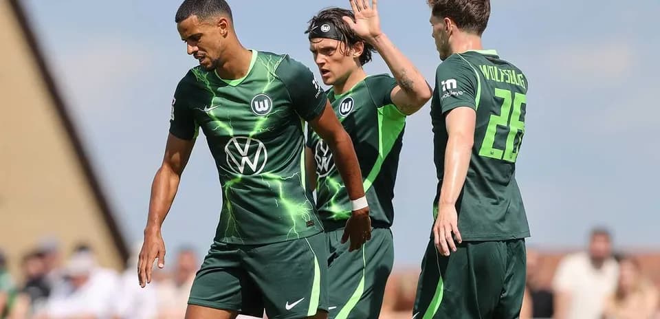 Wolfsburg players during training session on pitch