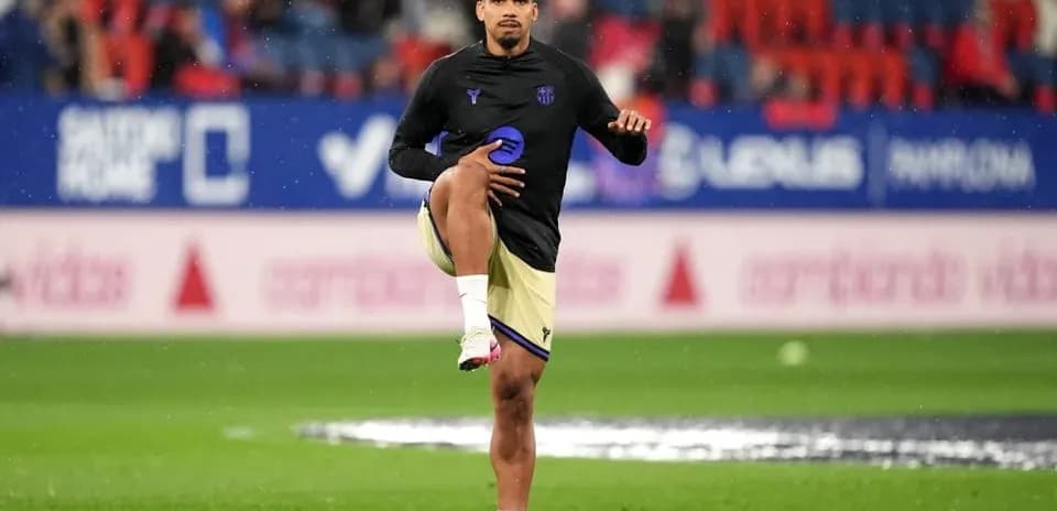 Player stretching during warm-up on the pitch