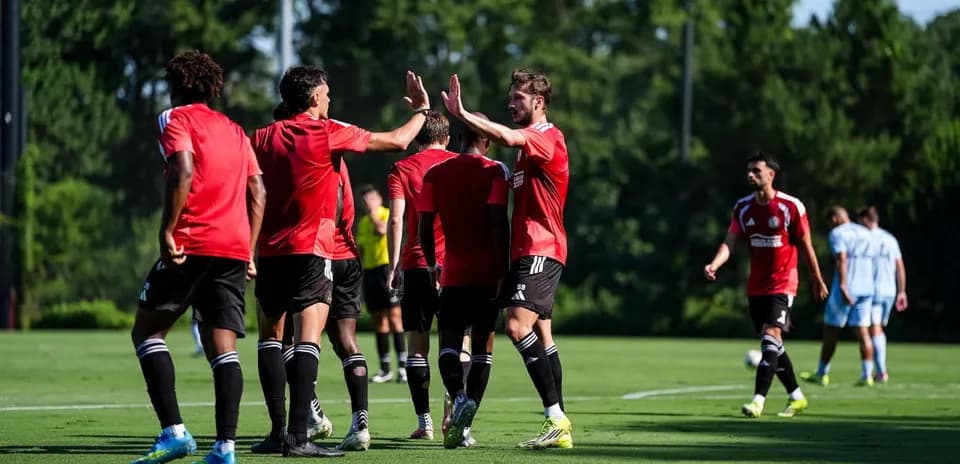 Atlanta United players celebrating on the field