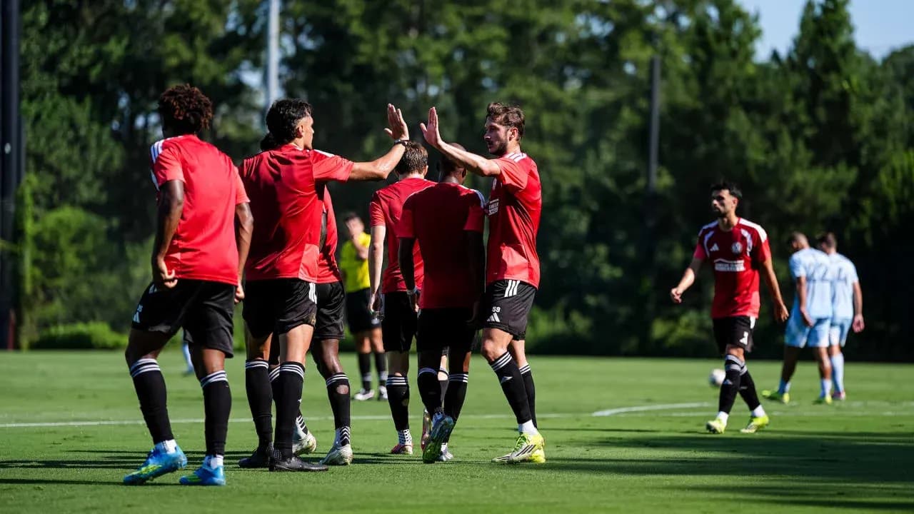 Atlanta United players celebrating on the field