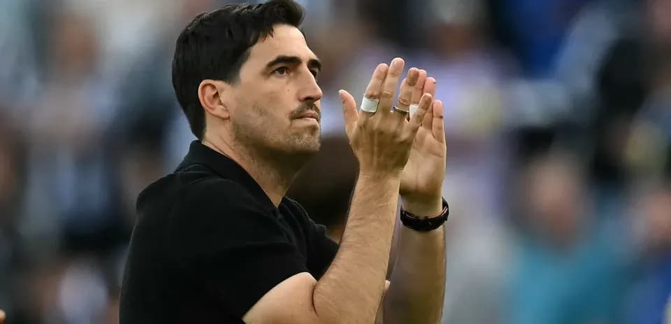 Coach applauding during a match celebration