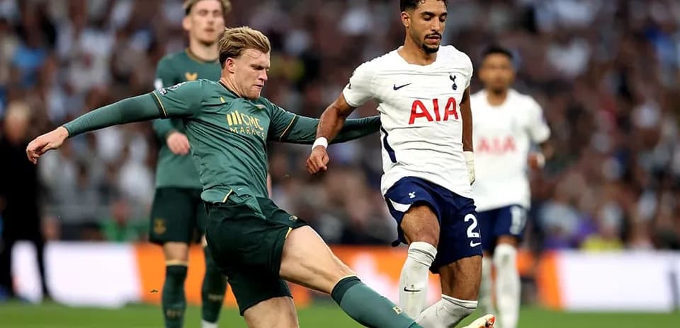 Player tackling opponent during a football match