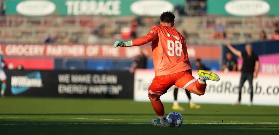 Goalkeeper preparing to kick the ball