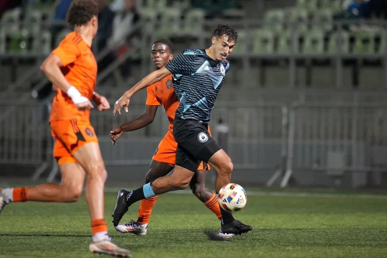 Tacoma Defiance player dribbling against Houston Dynamo FC II