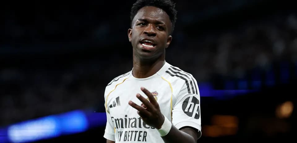 Player gesturing during a match in white uniform