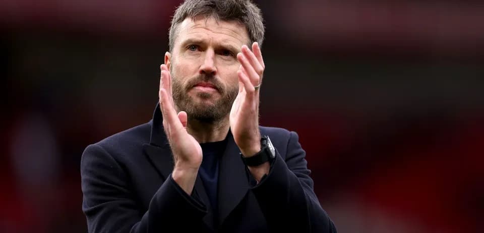 Coach applauding fans after a match