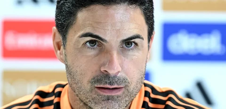 Manager speaking at press conference with serious expression