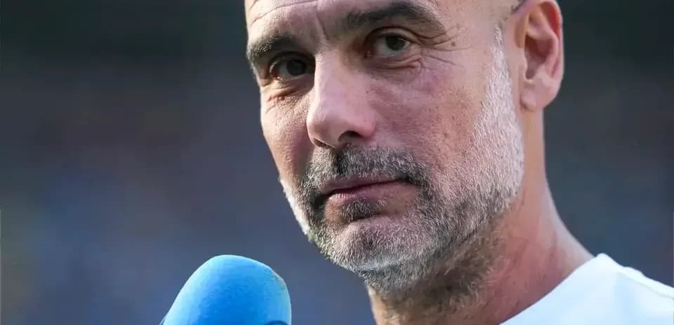 Coach speaking into microphone during interview