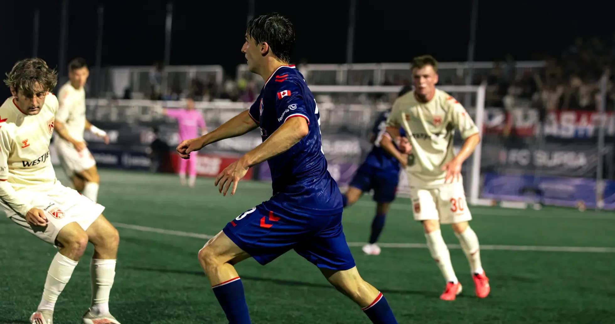 Cavalry FC player dribbling against Supra du Quebec