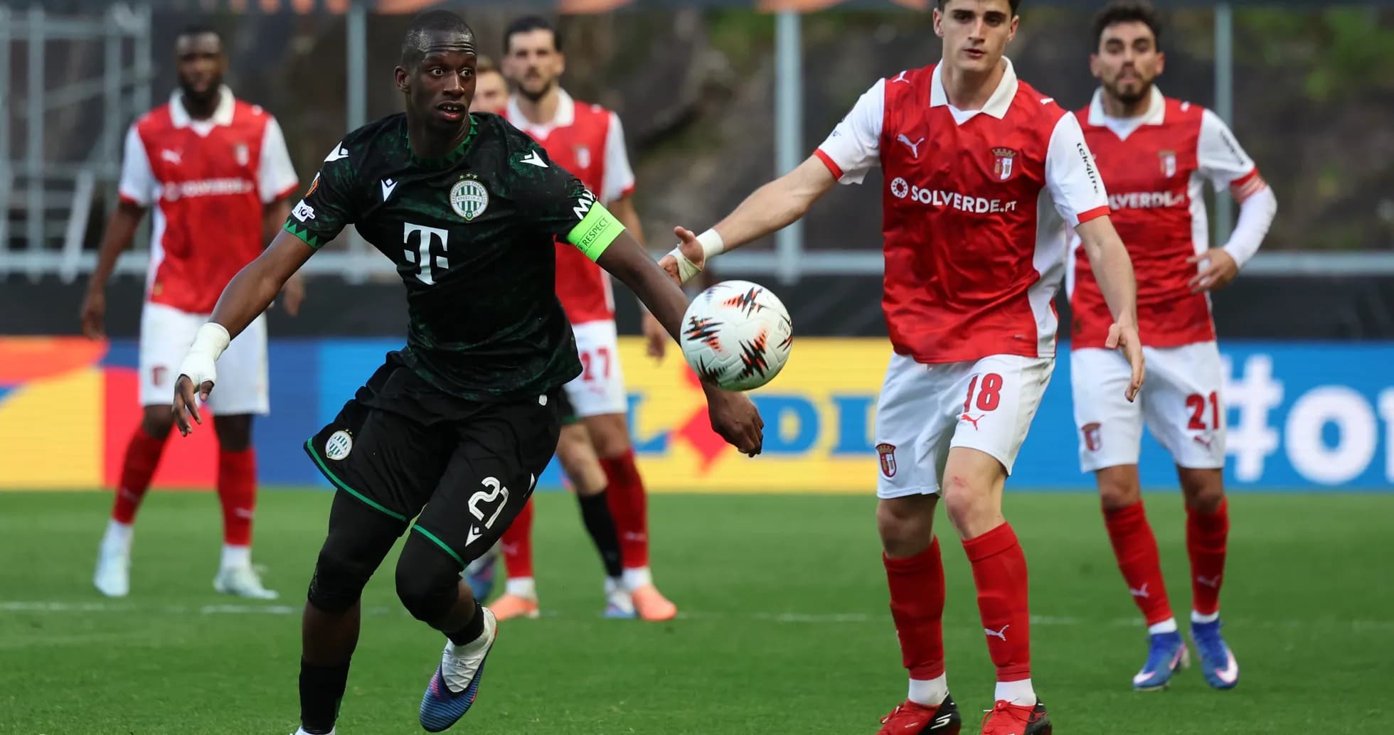 Ferencvarosi TC player dribbling during match
