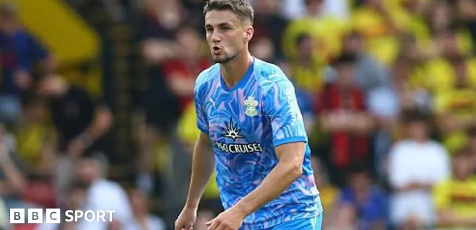 Player in blue jersey during football match