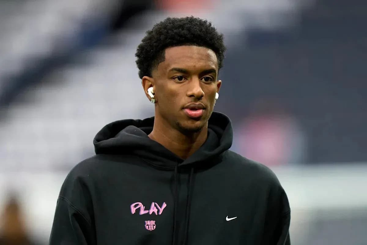Player wearing a hoodie and earbuds before match