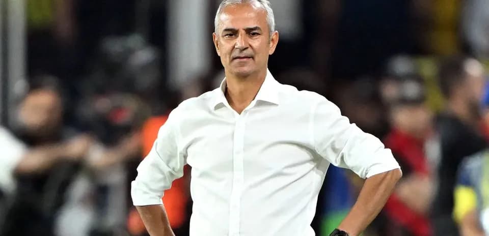 Coach standing on the sidelines during a match