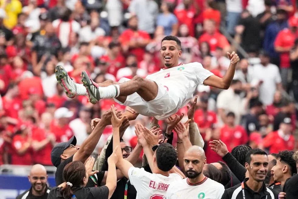 Player being lifted by teammates in celebration