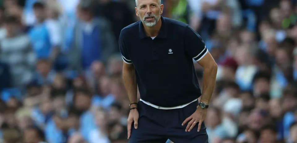 Manager observing the match from the sidelines