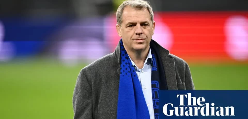 Man wearing a scarf at a sports venue