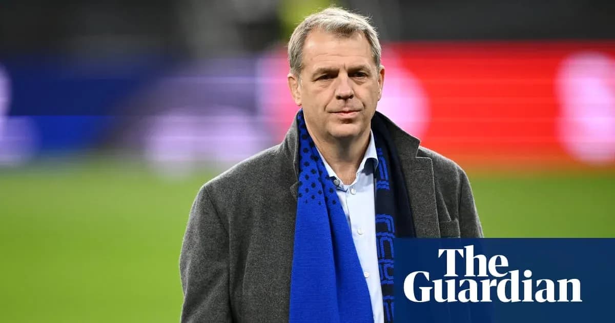 Man wearing a scarf at a sports venue