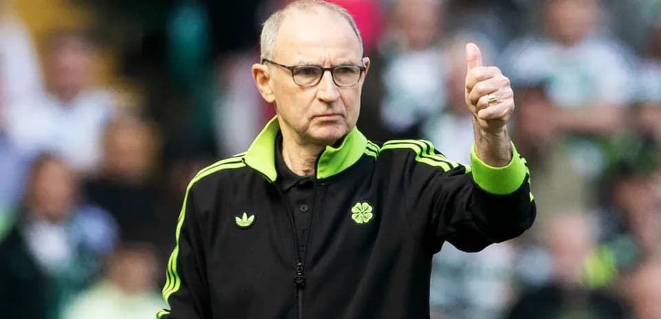 Coach giving a thumbs up during match