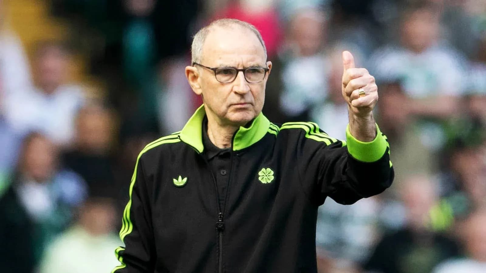 Coach giving a thumbs up during match