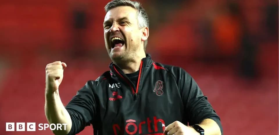 Coach celebrating passionately after a victory