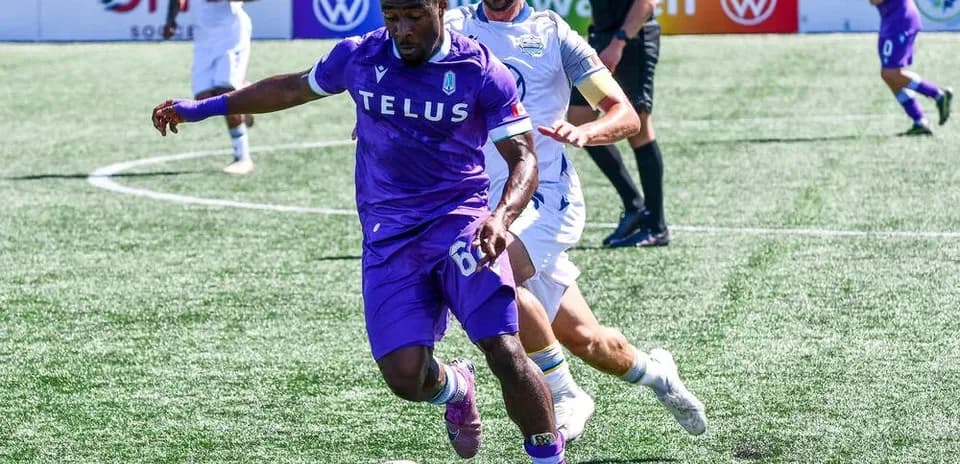 Player dribbling the ball during Pacific FC match