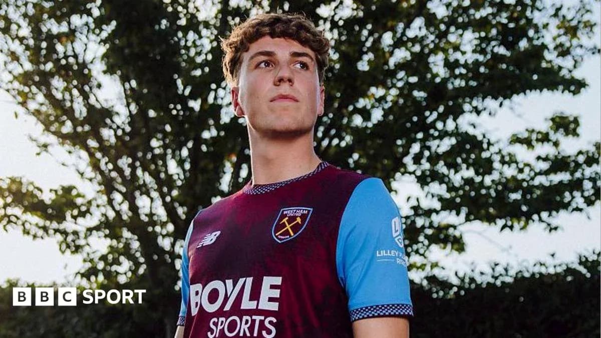 Player posing in West Ham United kit outdoors