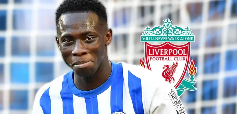 Football player in Brighton kit with Liverpool logo