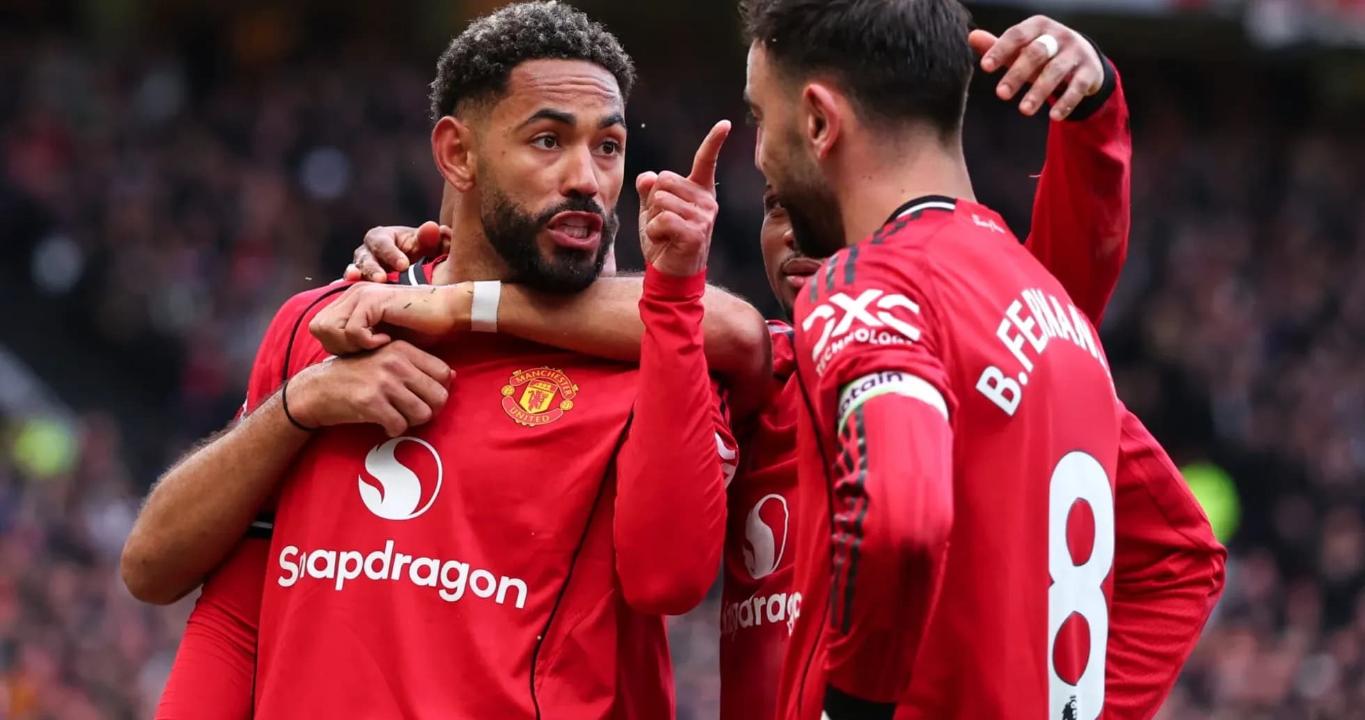 Manchester United players celebrating a goal together