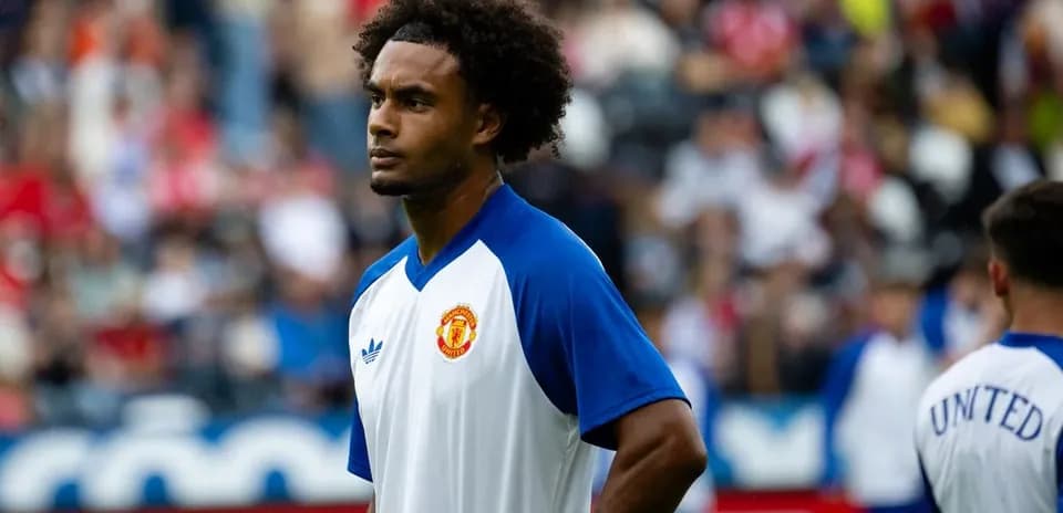 Player warming up in Manchester United training kit
