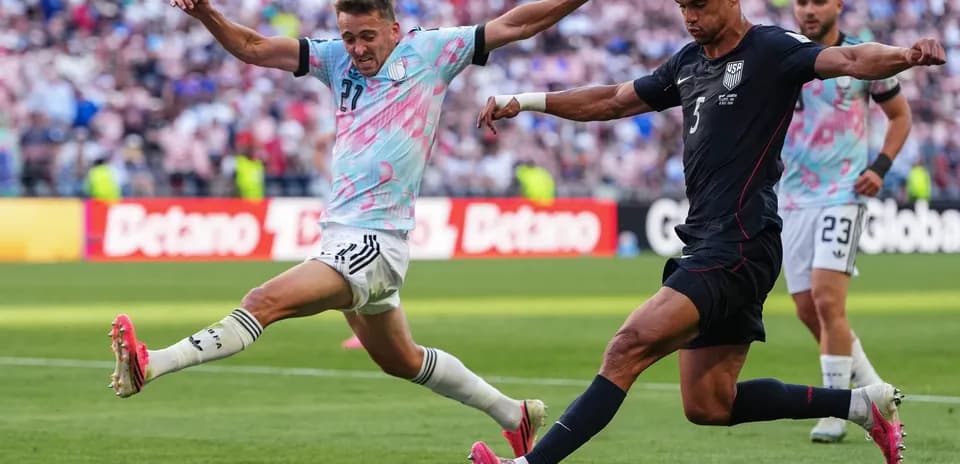 Player tackling during USA vs Belgium match