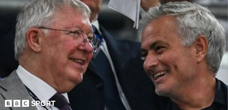 Two men chatting in a stadium box