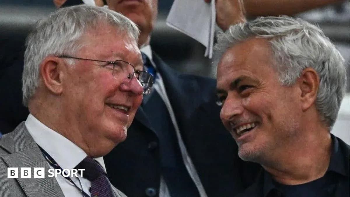 Two men chatting in a stadium box