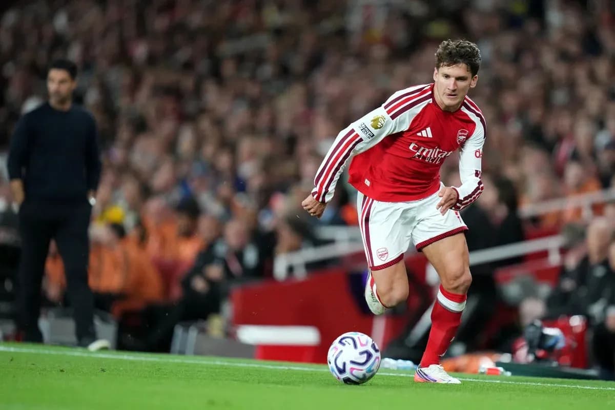 Arsenal player preparing to take a corner kick