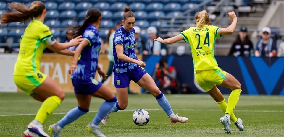Players competing for the ball during match